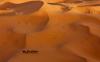 摩洛哥厄尔切比沙丘(Erg Chebbi)，沙漠中的骆驼骑兵。